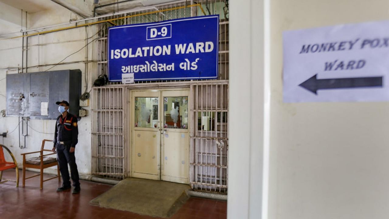 A security personnel stands guard outside an isolation ward dedicated for patients showing monkeypox symptoms, at Civil Hospital in Ahmedabad. Credit: PTI Photo