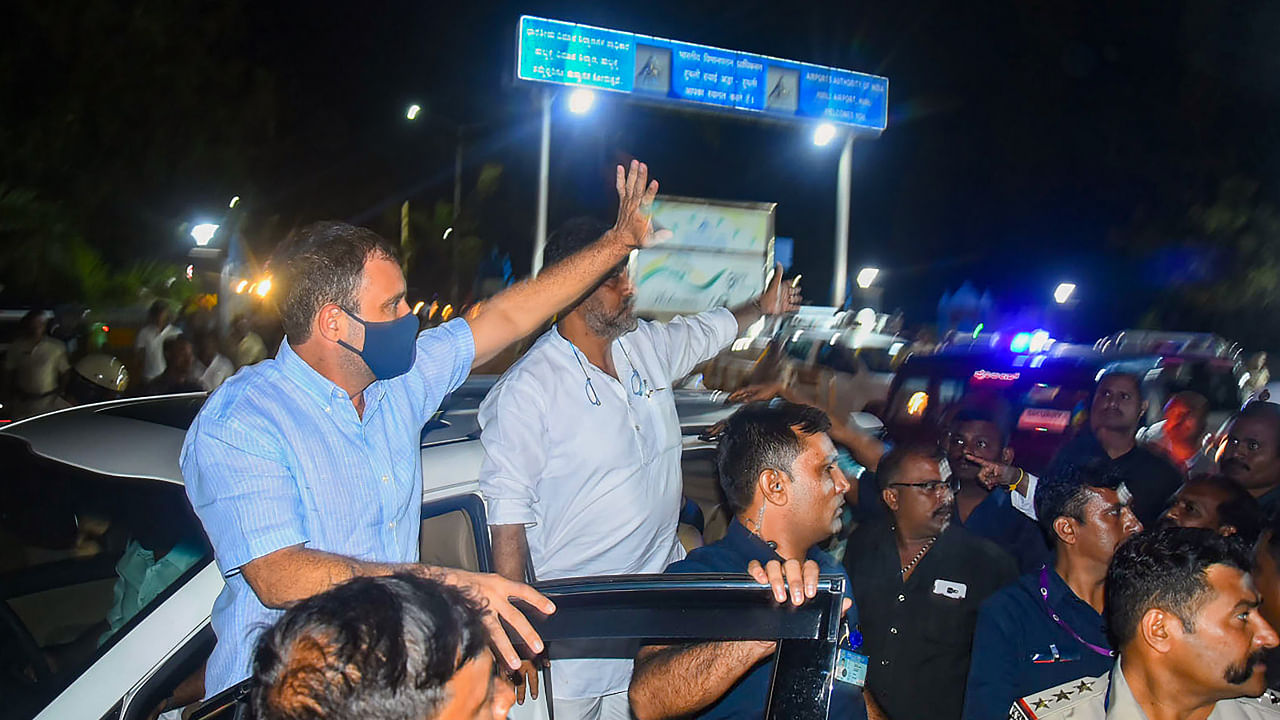 Congress leader Rahul Gandhi with Kartanaka Congress President D K Shivakumar waves towards supporters upon his arrival in Hubballi, Tuesday, Aug. 2, 2022. Credit: PTI Photo