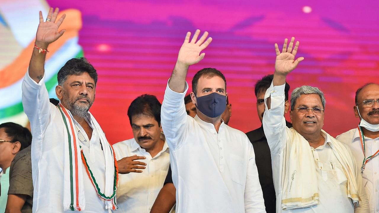 Congress leader Rahul Gandhi with KPCC President D K Shivakumar and former Karnataka CM and Congress Legislature Party (CLP) leader Siddaramaiah, during the latter's 75th birthday celebrations, in Davangere. Credit: PTI Photo