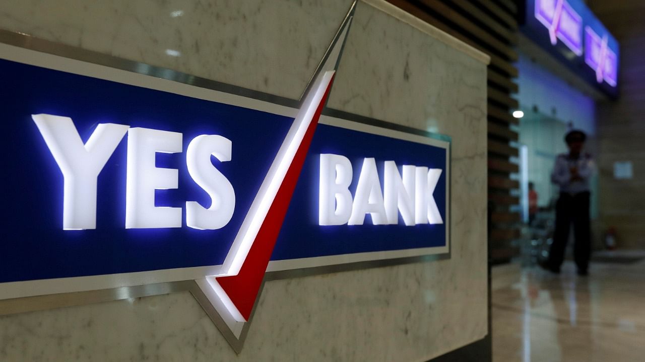 A security guard stands outside a Yes Bank branch at its headquarters in Mumbai. Credit: Reuters Photo