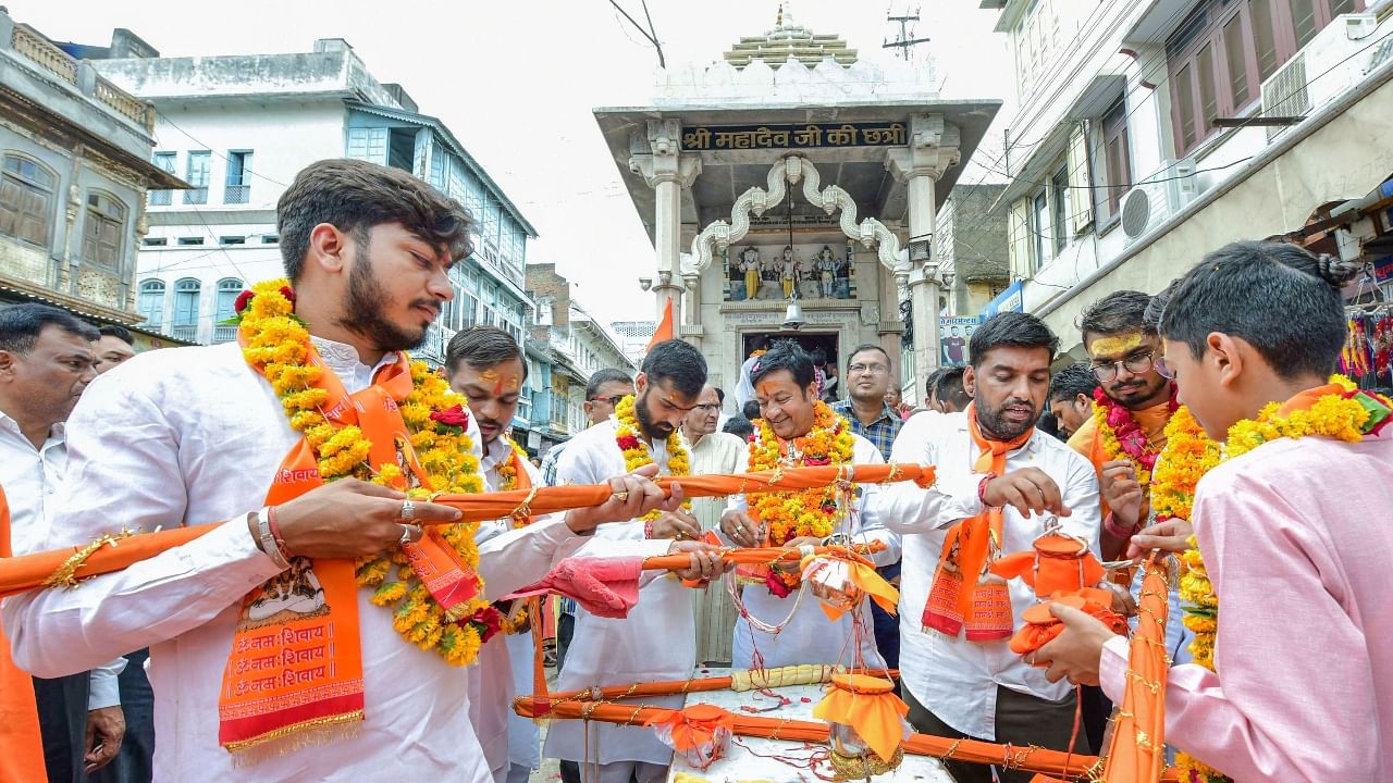 Kanwariyas (Lord Shiva devotees) during their pilgrimage in the holy month of 'Shravan', in Beawar. Credit: PTI Photo