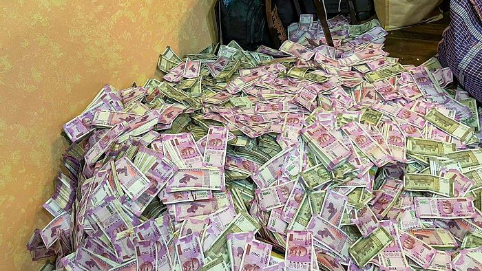 Crores of rupees in cash were allegedly seized from the residence of a woman, who apparently happens to be a close associate of senior TMC leader and state minister Partha Chatterjee, according to ED sources. Credit: PTI Photo