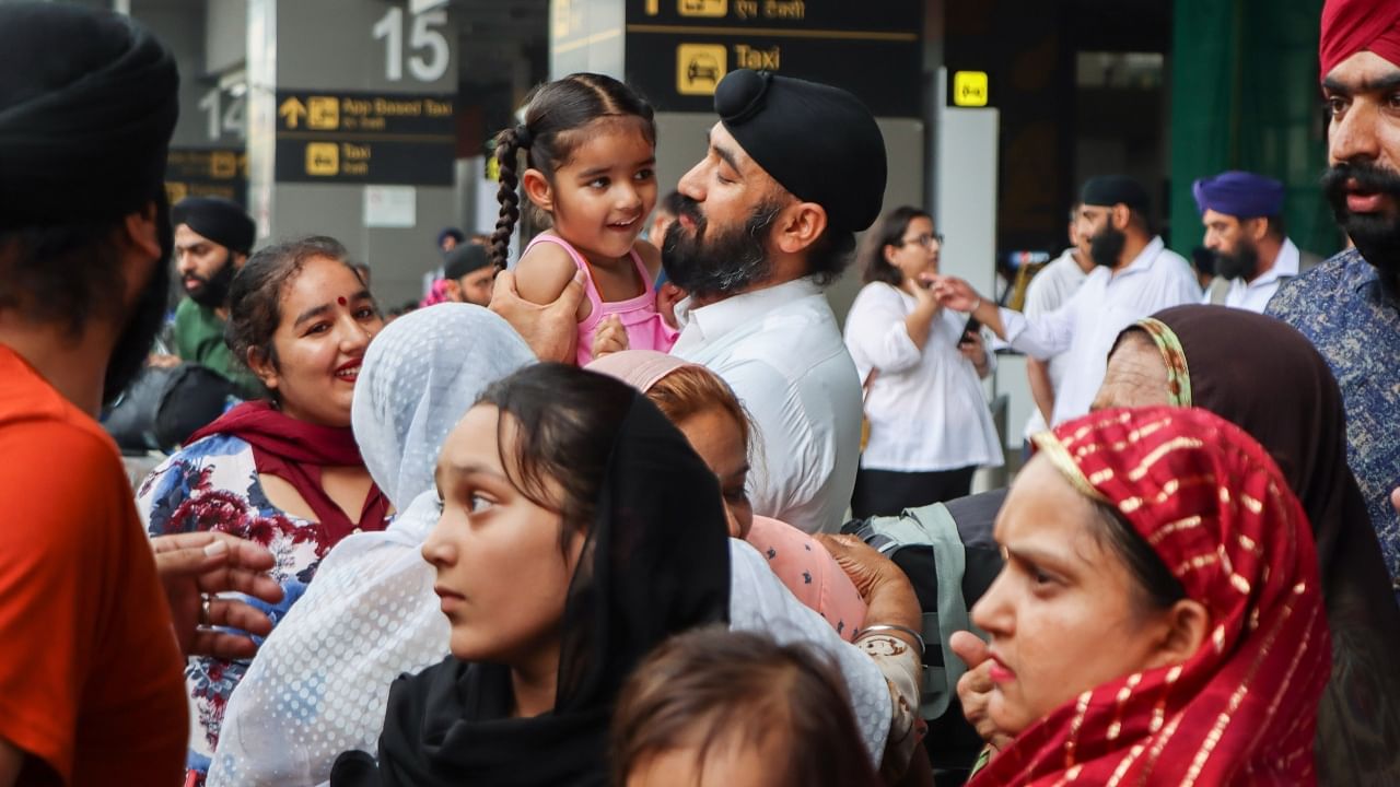 People belonging to the Sikh community arrive at New Delhi airport from Afghanistan, after recent incidents of terror attacks on minorities, in New Delhi. Credit: PTI Photo