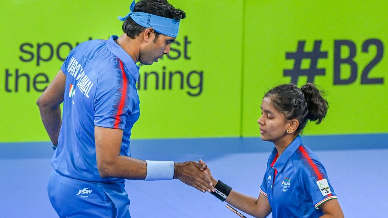 India's mixed doubles pair Sharath Kamal and Akula Sreeja greet each other after their match Australia during Mixed Doubles Table Tennis semi-final match at the Commonwealth Games 2022. Credit: PTI Photo