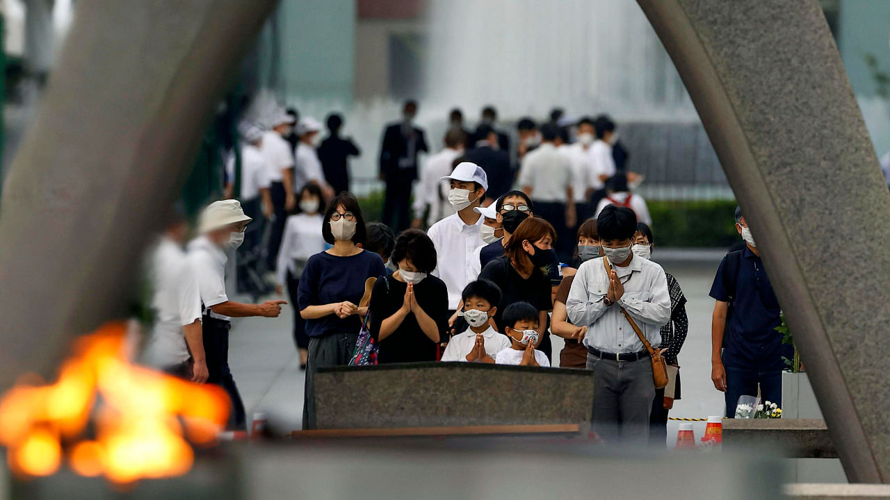 Visitors pray in front of the cenotaph dedicated to the victims of the atomic bombing at the Hiroshima Peace Memorial Park in Hiroshima, western Japan Saturday, Aug. 6, 2022. Credit: AP Photo 
