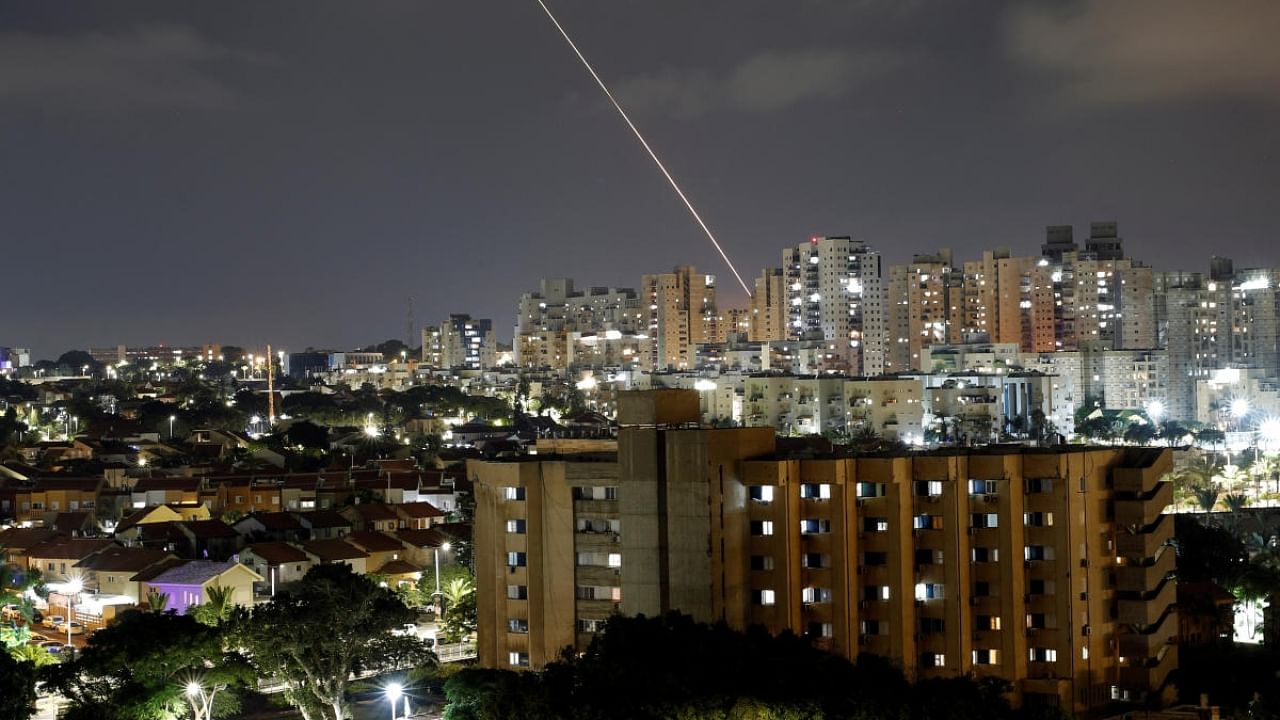 A streak of light is seen as a rocket has been launched from the Gaza Strip towards Israel, as seen from Ashkelon, Israel August 5, 2022. Credit: Reuters Photo
