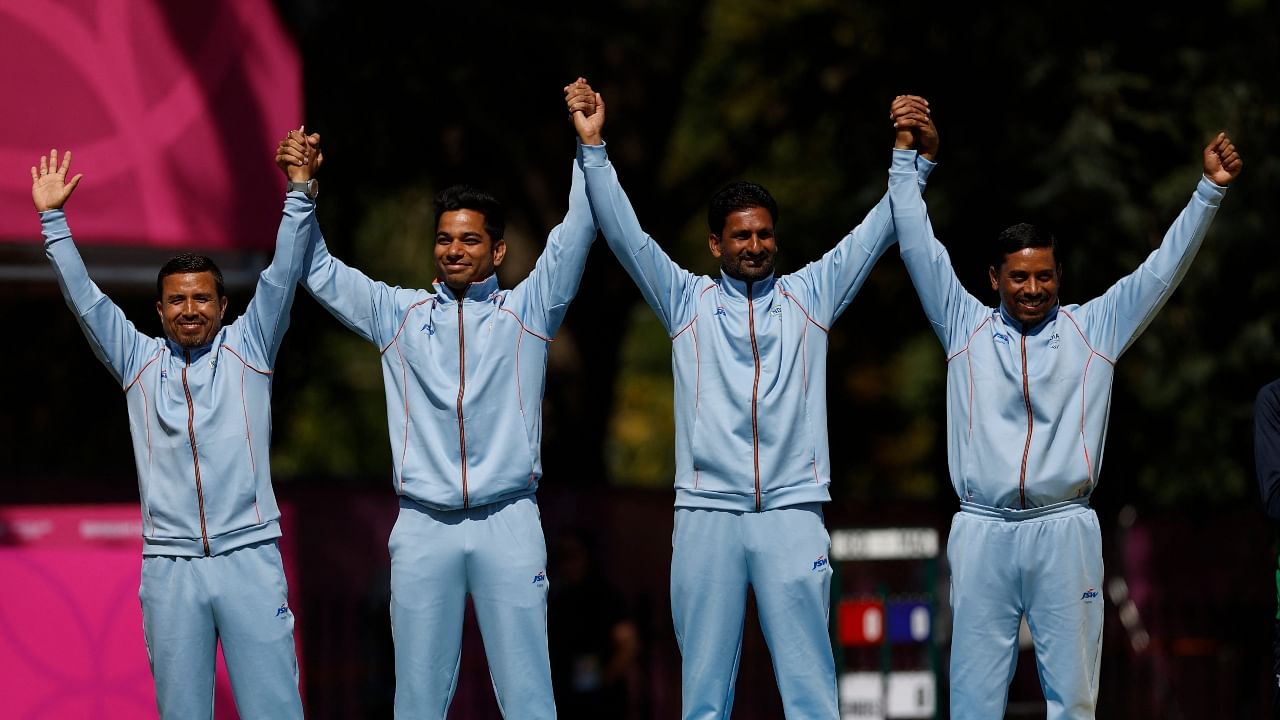 Silver medallists India's Navneet Singh, Dinesh Kumar, Sunil Bahadur and Chandan Kumar Singh celebrate on the podium. Credit: Reuters Photo