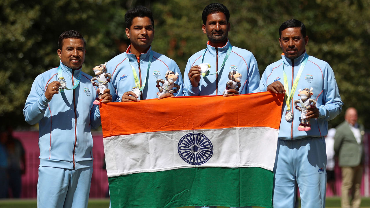 India's Silver medalists Sunil Bahadur, Navneet Singh, Chandan Kumar Singh and Dinesh Kumar pose on the podium in Birmingham, August 6, 2022. Credit: AP/PTI Photo