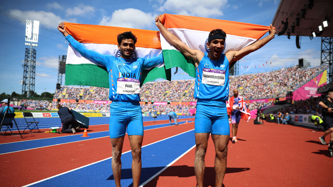 India's Eldhose Paul and Abdulla Aboobacker Narangolintevida celebrate after winning gold and silver respectively, Birmingham, August 7, 2022. Credit: Reuters Photo
