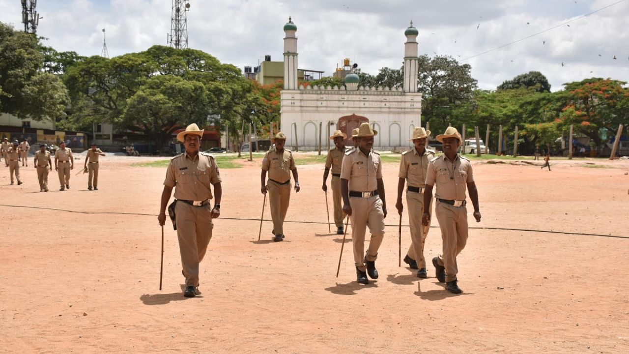 Police personnel go on rounds of the Chamarajpet Idgah Maidan ground during a recent protest over ownership. Credit: DH file Photo