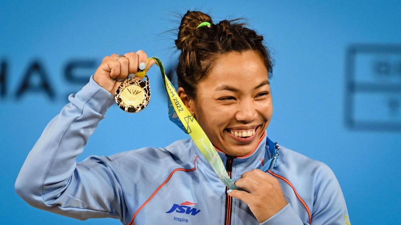  India's Mirabai Chanu reacts after winning the gold medal in the women's 49kg weightlifting category match of the Commonwealth Games 2022 (CWG), in Birmingham, UK, Saturday, July 30, 2022. Credit: PTI Photo