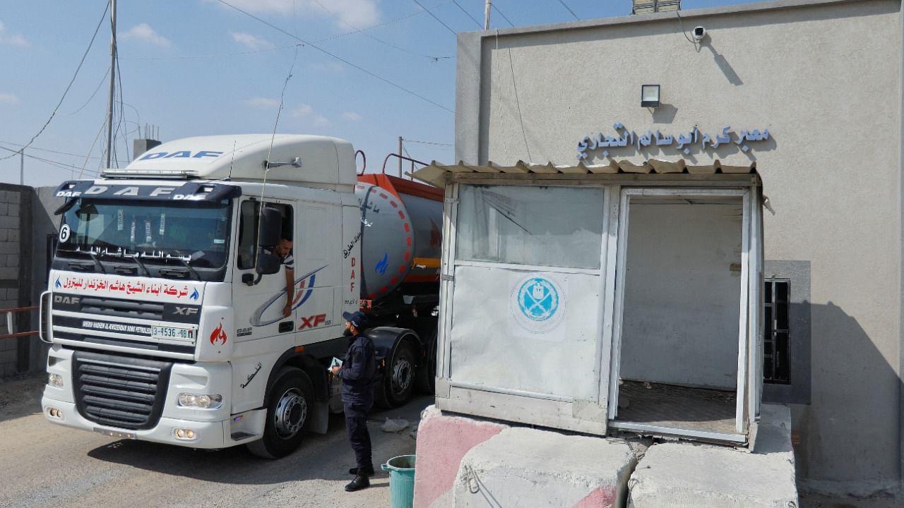 A truck carrying fuel imports for the lone power plant rolls into Gaza, after Israel eased up closures, as ceasefire holds in Rafah in the southern Gaza Strip, August 8, 2022. Credit: Reuters File Photo