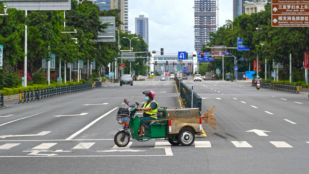 A sanitation worker drives past an intersection amid lockdown measures to curb the coronavirus disease outbreak in Sanya, Hainan province, China August 6, 2022. Credit: Reuters Photo 