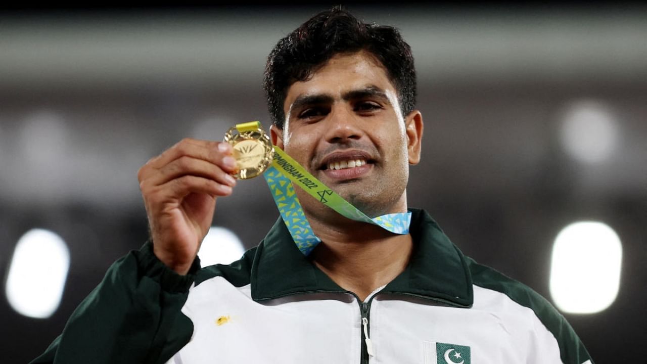Gold medallist Pakistan's Arshad Nadeem celebrates on the podium. Credit: Reuters Photo