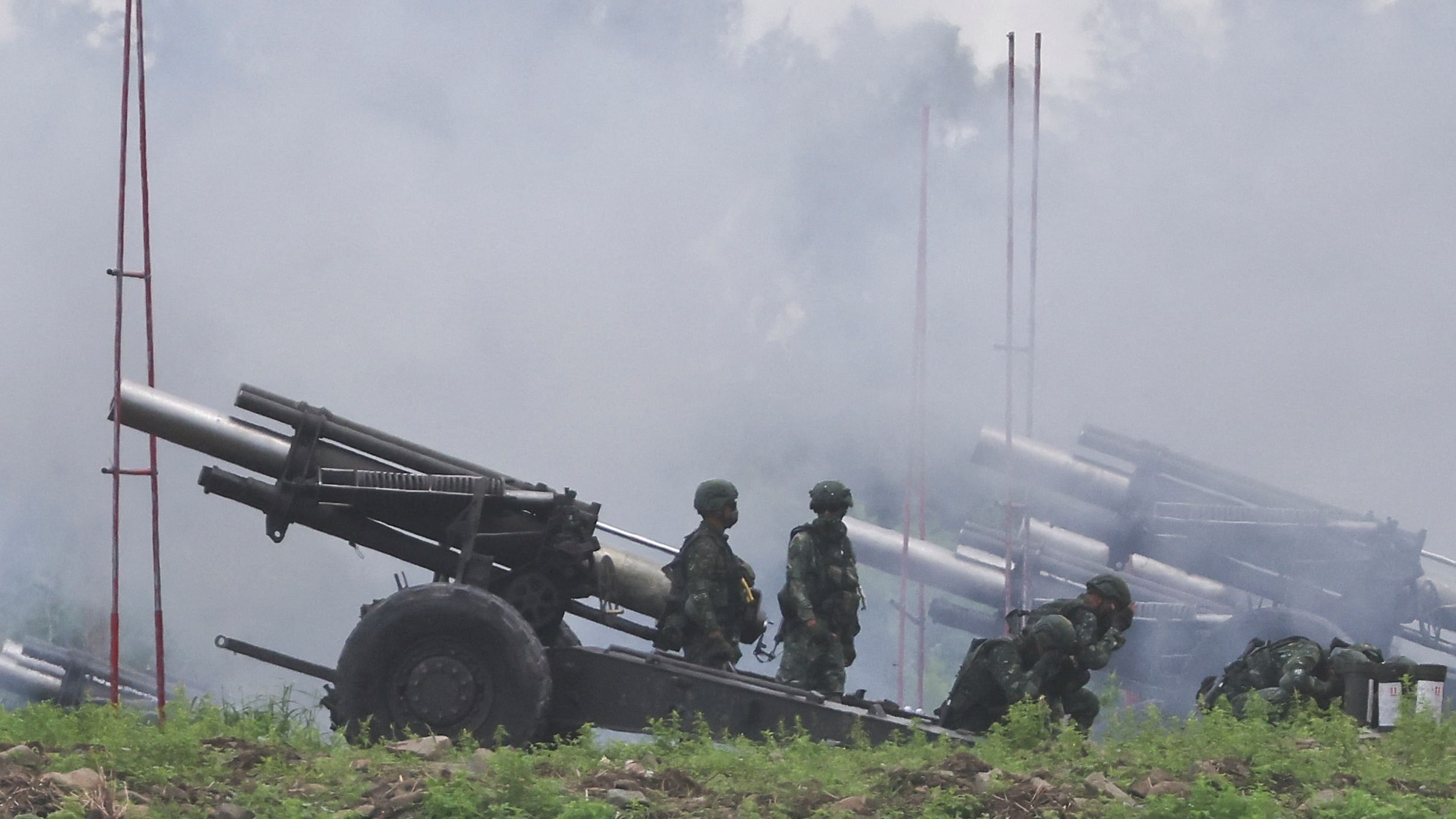 Soldiers fire 155mm howitzers during an annual live fire military exercise in Pingtung county, southern Taiwan August 9, 2022. Credit: Reuters Photo