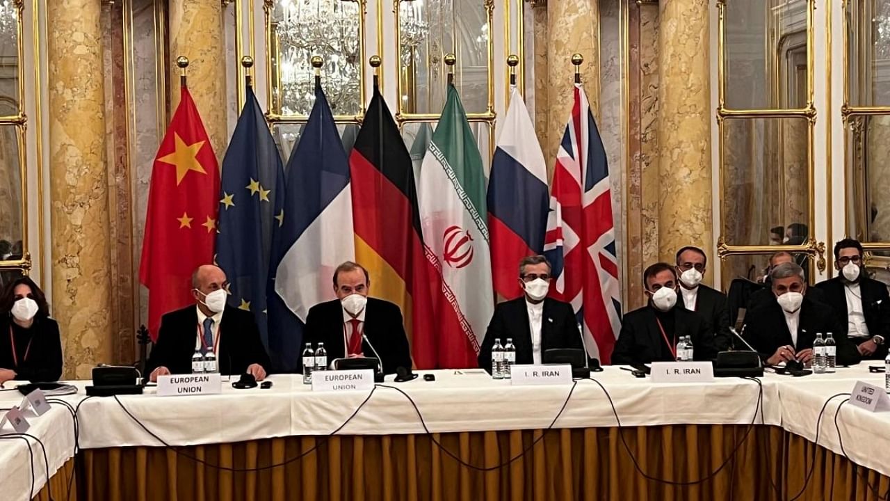 EU delegation in Vienna shows representatives from Iran (R) and the European Union (L) attending a meeting of the joint commission on negotiations aimed at reviving the Iran nuclear deal in Vienna, Austria. Credit: AFP File Photo