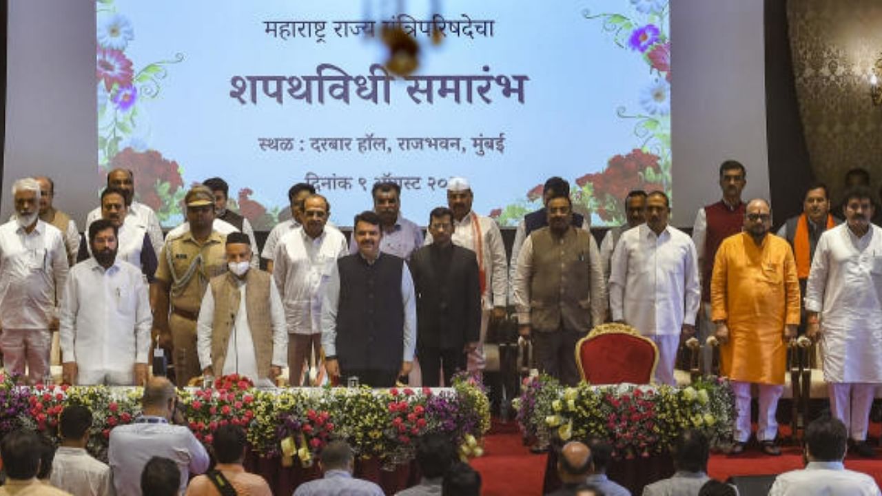 Maharashtra Governor Bhagat Singh Koshyari, Chief Minister Eknath Shinde and Dy CM Devendra Fadnavis with newly sworn-in ministers, at a ceremony at Raj Bhavan in Mumbai, Tuesday, Aug. 9, 2022. Credit: PTI Photo