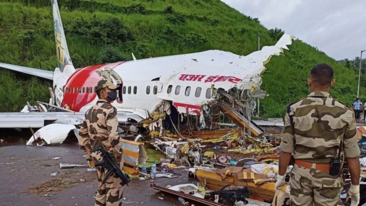 Those involved in the rescue work after the Air India Express flight from Dubai with 190 people on board crashed at the Karipur airport here have been advised to go on quarantine after samples of one of the passenger who died tested positive for Covid-19. Credit: PTI Photo
