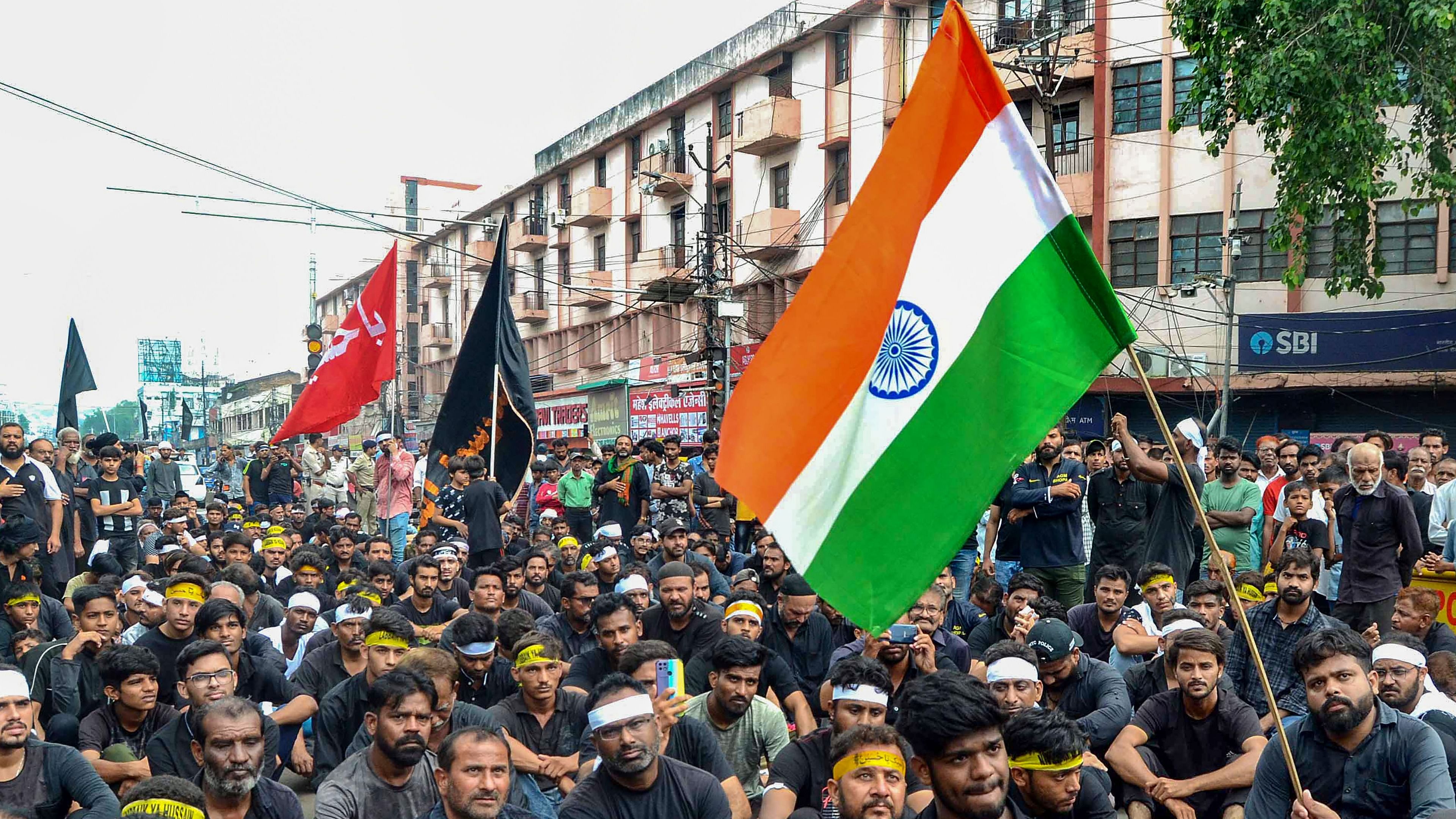 Shia Muslims during a religious procession on the tenth day of the mourning period of Muharram, which marks the day of Ashura, in Bhopal. Credit: PTI Photo