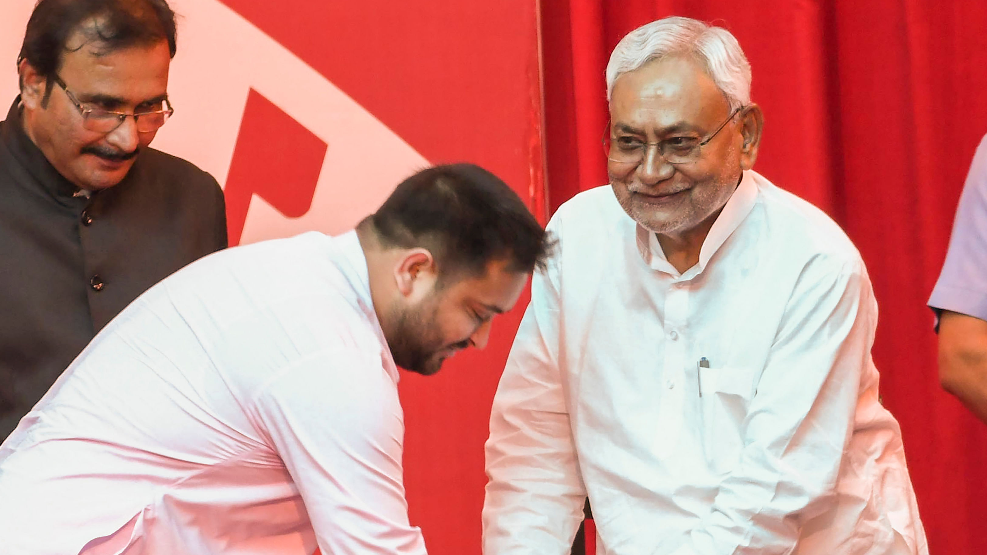 Bihar Chief Minister Nitish Kumar with his deputy Tejashwi Yadav during their swearing-in ceremony. Credit: PTI Photo