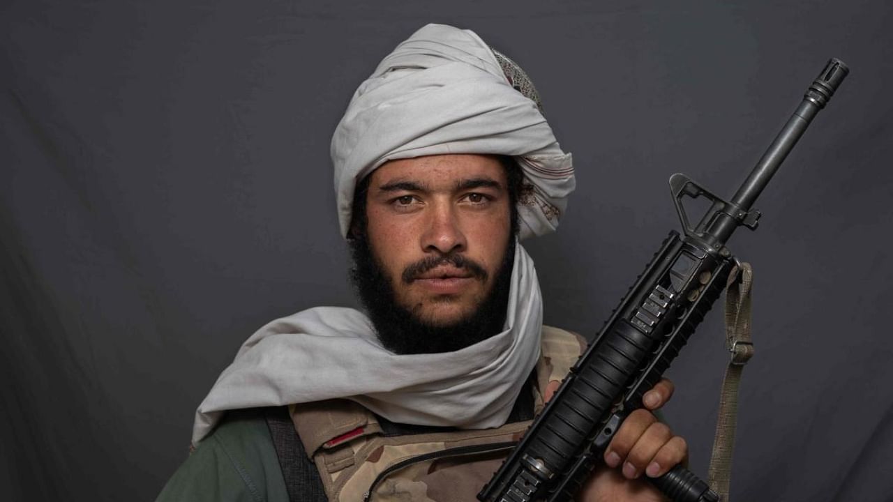 22-year-old Taliban fighter Matiullah Quraishi poses for a portrait at a checkpoint in Kandahar. Credit: AFP Photo