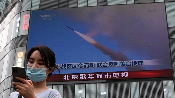 A large screen showing a news broadcast about China's military exercises encircling Taiwan, in Beijing on August 4, 2022. Credit: AFP File Photo