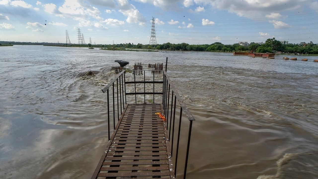 Yamuna river flows near the danger mark, following monsoon rains in upper catchment areas, in New Delhi, Friday, August 12, 2022. Credit: PTI Photo