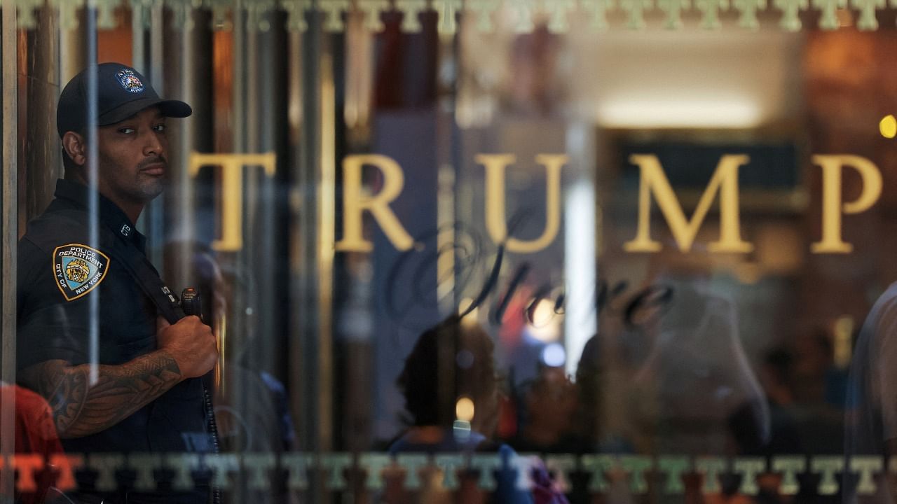 An officer from the New York City Police Department (NYPD) stands guard inside Trump Tower. Credit: Reuters Photo