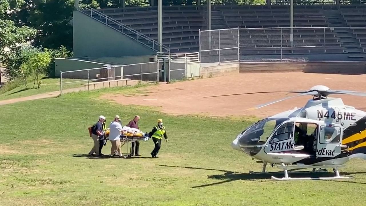 Author Salman Rushdie is transported to a helicopter after he was stabbed on stage before his scheduled speech at the Chautauqua Institution, Chautauqua. Credit: Reuters Photo