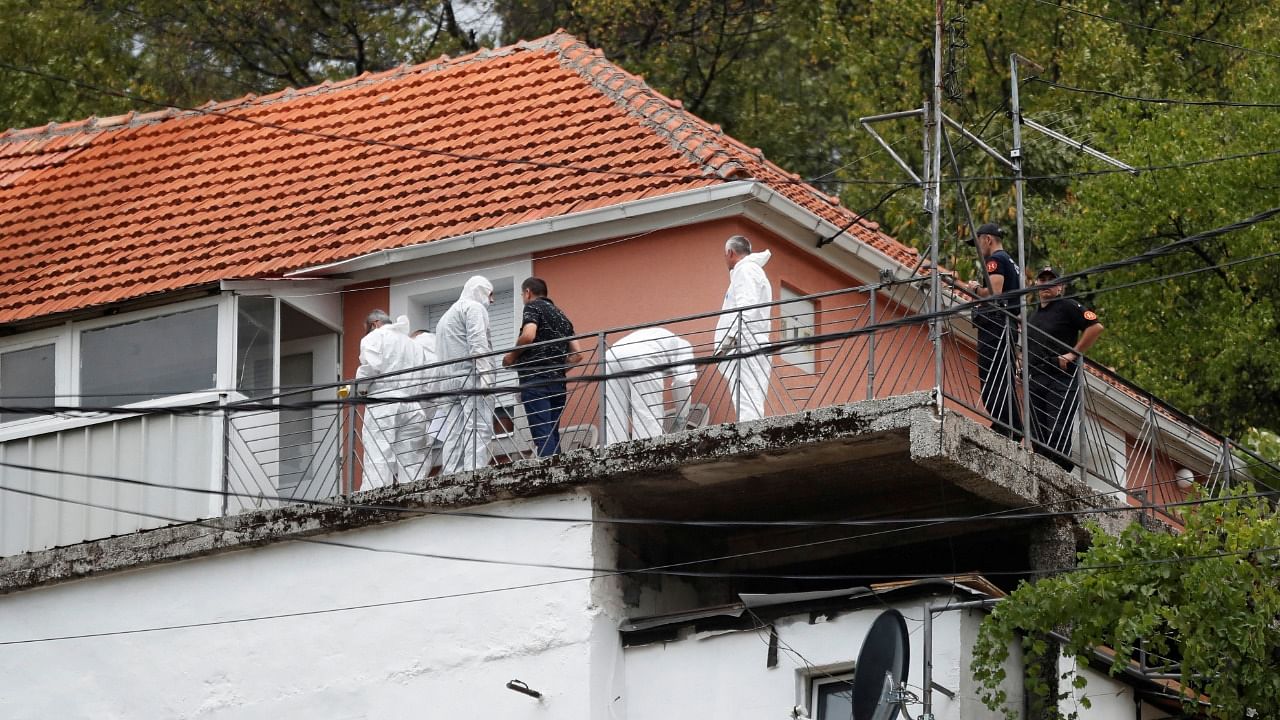 Police forensic team inspect the house where a gunman started a mass shooting in which 12 people, including the gunman, were killed, according to local media reports, in Cetinje, Montenegro. Credit: Reuters Photo