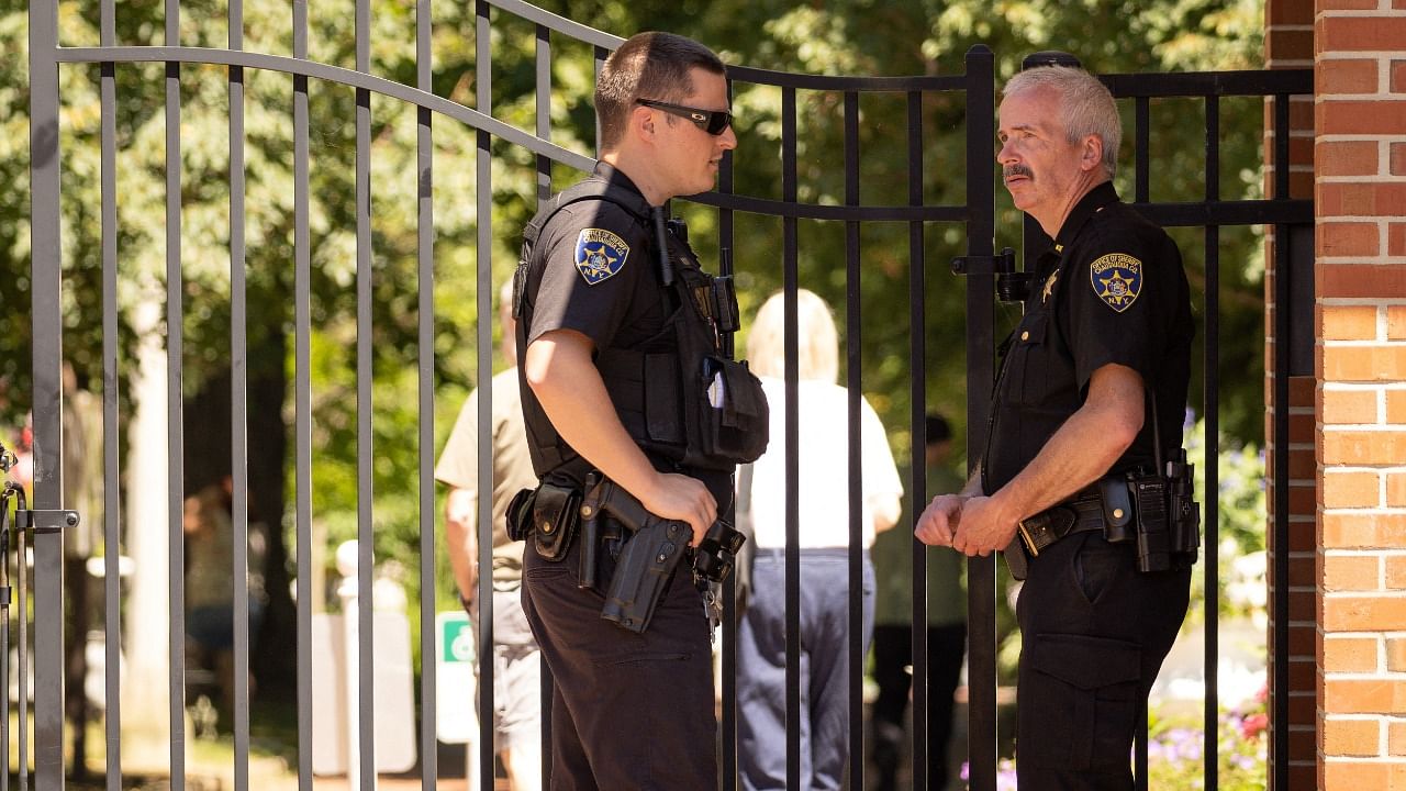 Chautauqua County Sheriffs stand outside the main gate of the Chautauqua Institution where Salman Rushdie, Indian-born novelist who was once ordered killed by Iran in 1989 because of his writing, was attacked on stage at an event in New York, US. Credit: Reuters Photo