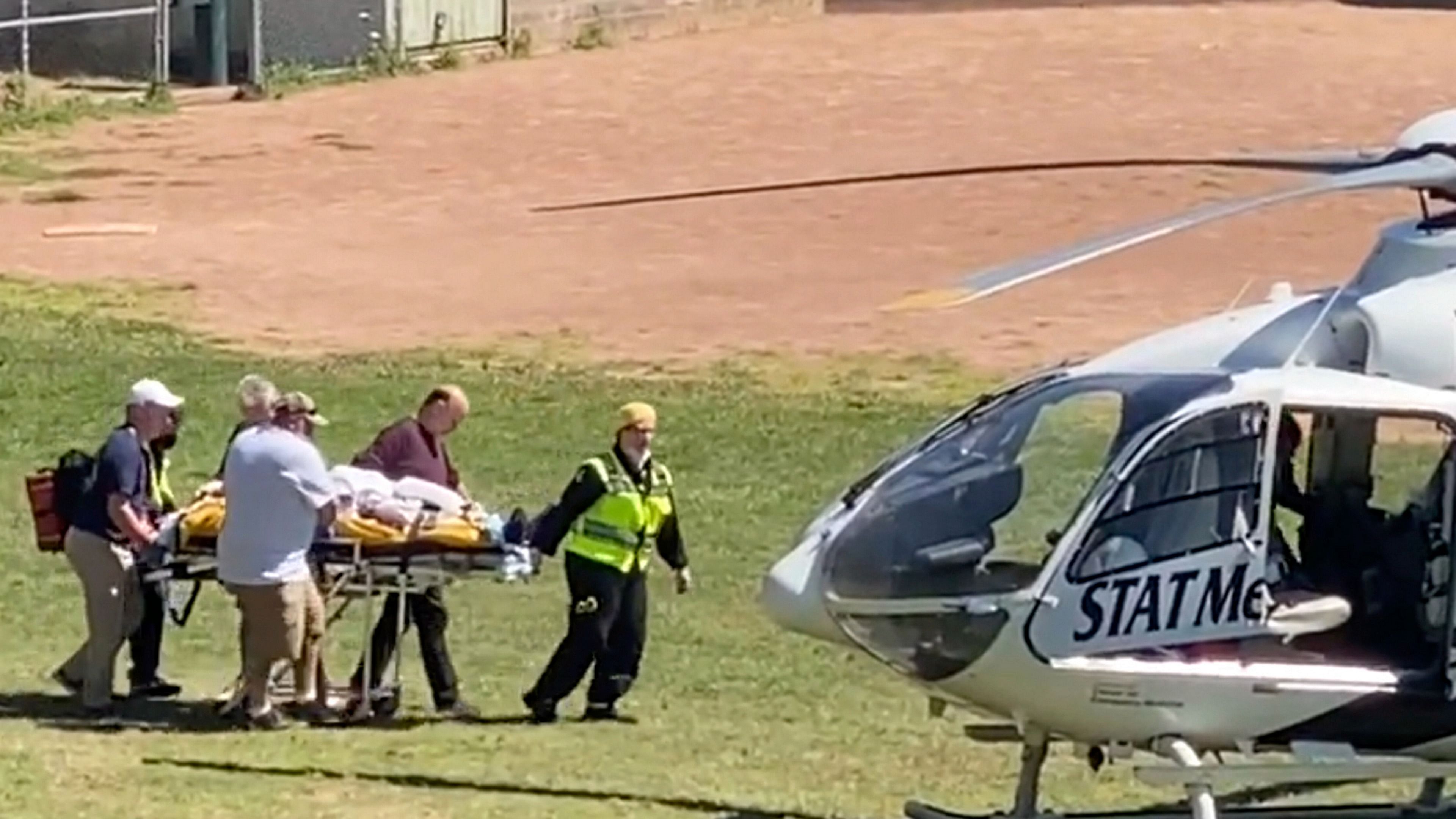 Author Salman Rushdie is taken on a stretcher to a helicopter for transport to a hospital after he was attacked during a lecture at the Chautauqua Institution in Chautauqua, N.Y. Credit: AP/PTI Photo