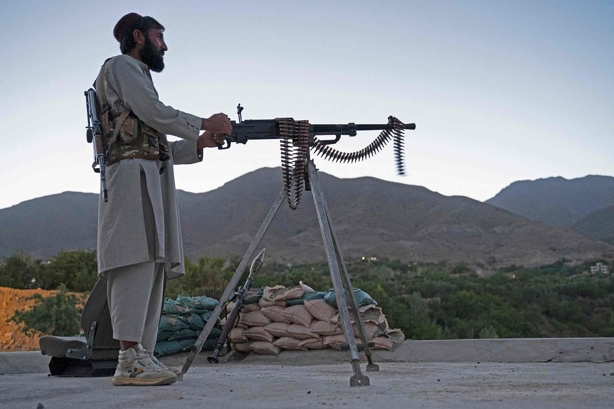 A Taliban fighter keeping a watch at an outpost in Tawakh Village of Anaba district, Panjshir Province. Credit: Reuters Photo