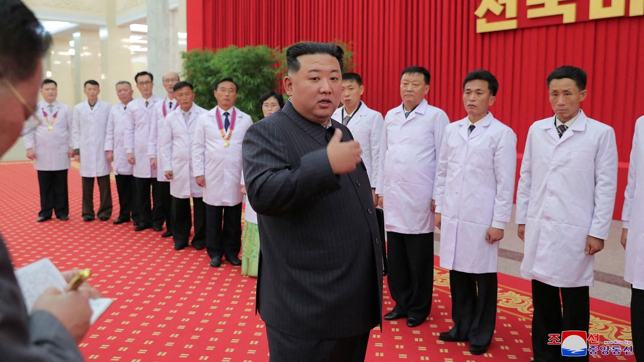 North Korea's leader Kim Jong Un encourages health workers and scientists struggling with Covid-19 in Pyongyang. Credit: Reuters photo