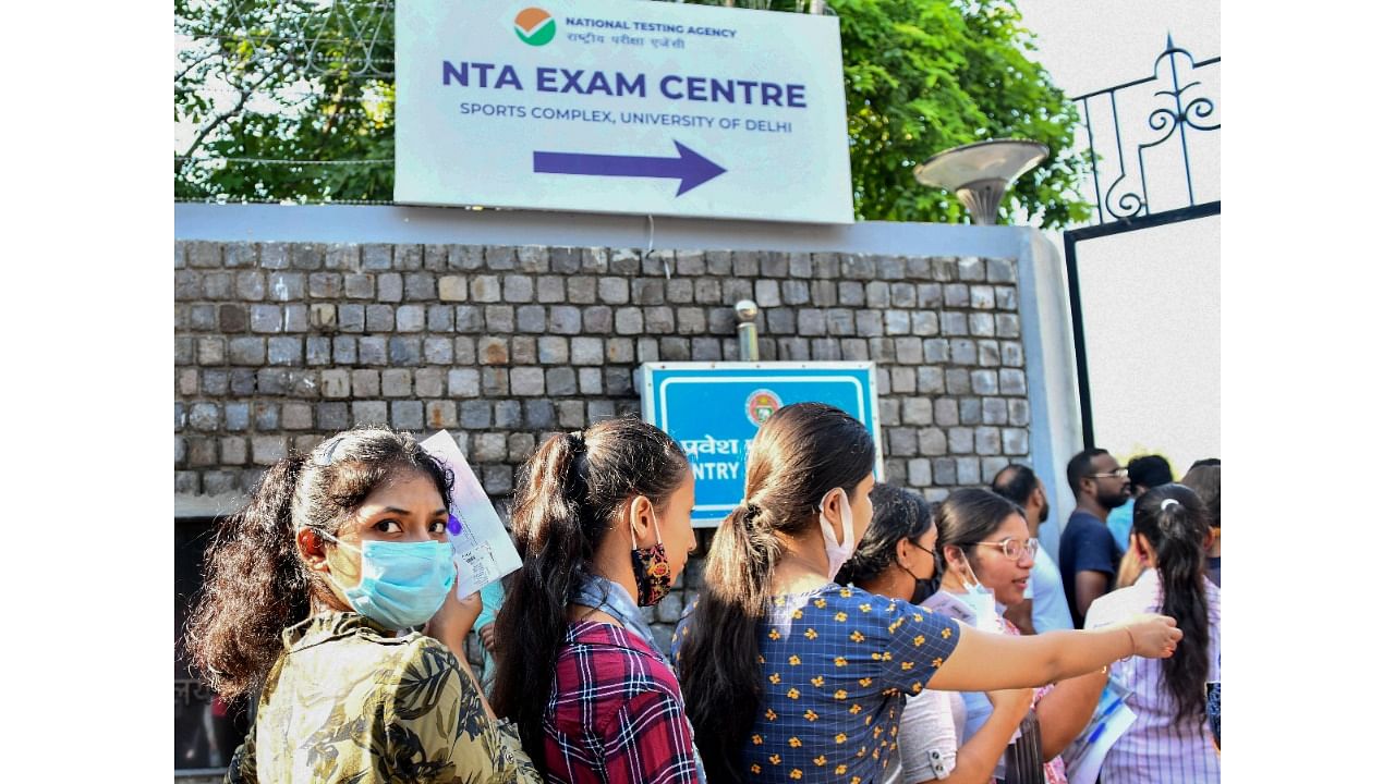 Students arrive to appear for the Common University Entrance Test-Undergraduate (CUET UG 2022), in New Delhi, Friday, July 15. Credit: PTI Photo