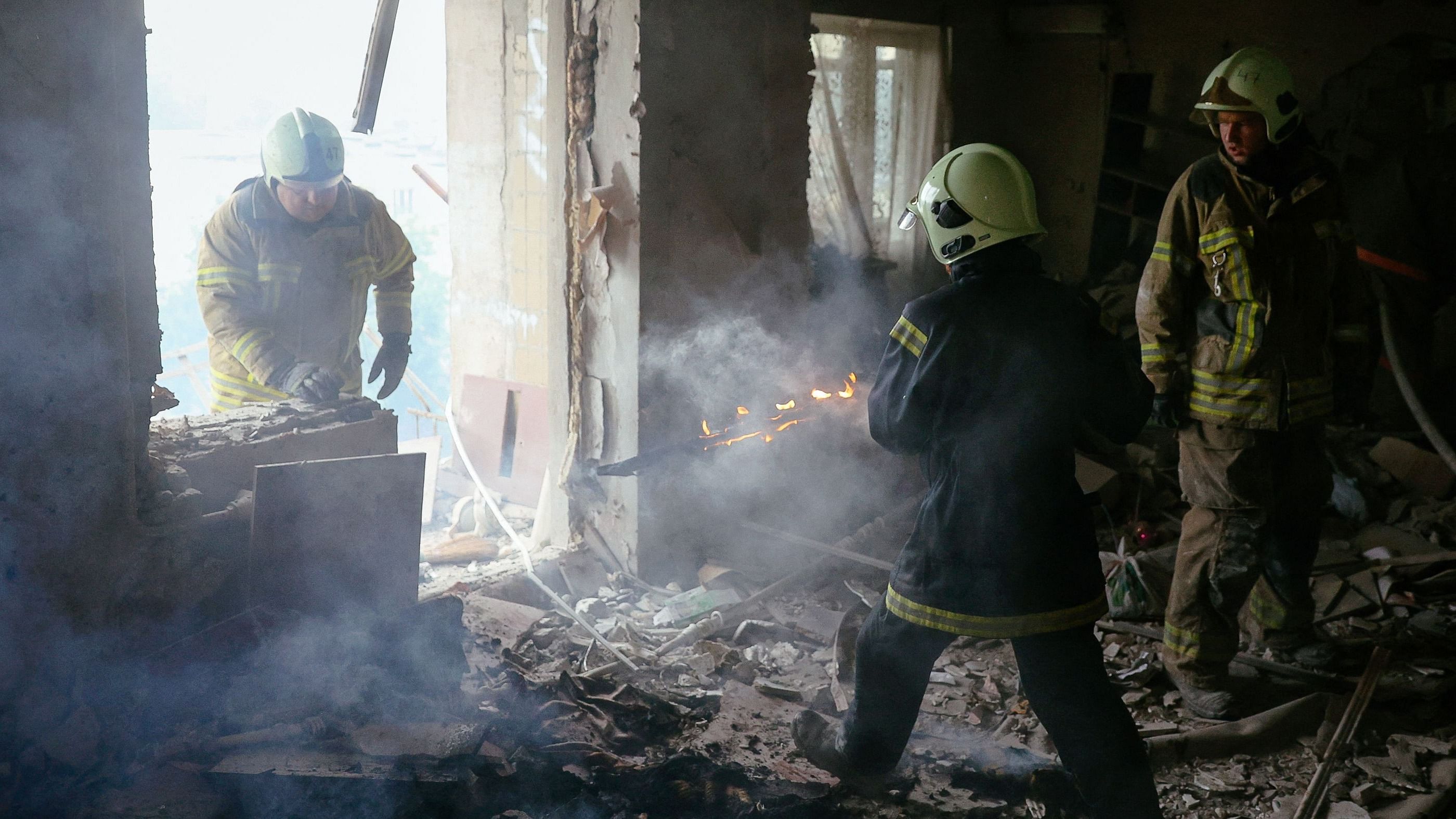 Firefighters put out the fire in a destroyed house following a shelling in Bakhmut, Donetsk region on August 13, 2022, amid the Russian military invasion of Ukraine. Credit: AFP Photo