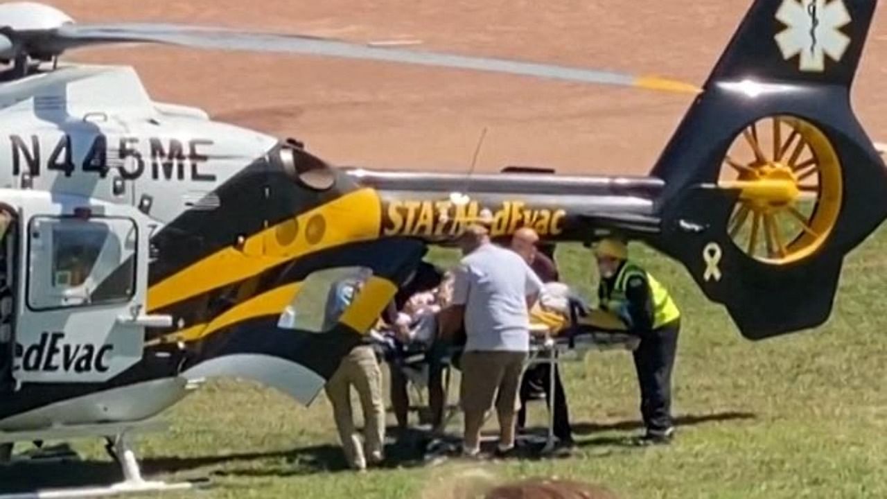 Salman Rushdie is seen being loaded onto a medical evacuation helicopter near the Chautauqua Institution after being stabbed in the neck while speaking on stage in Chautauqua, New York. Credit: AFP Photo