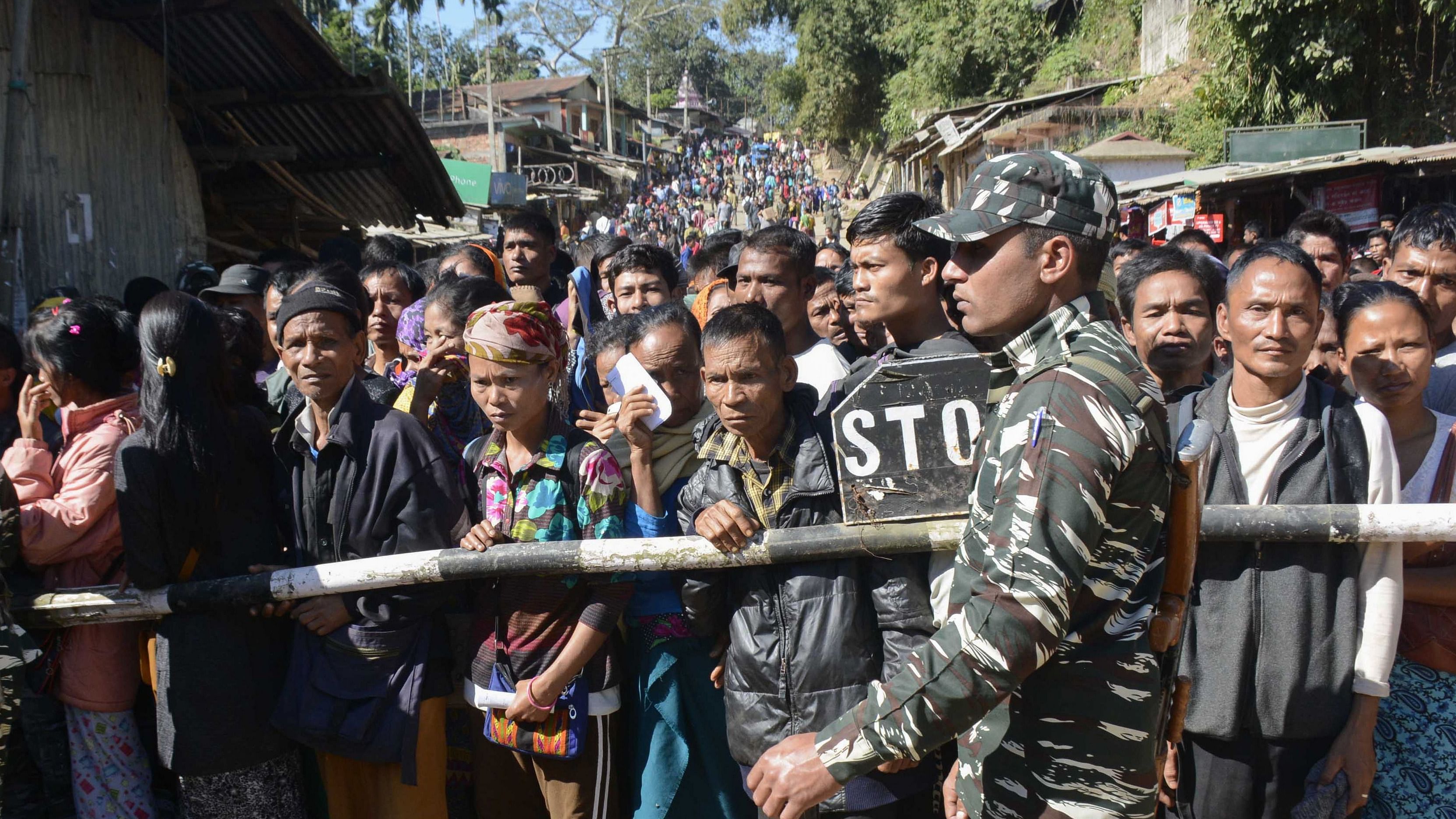 Internally displaced Bru Reang tribespeople wait to cross the border between India's Tripura into Mizoram states, to cast their votes in the Mizoram state assembly election at Kanhmun in Mamit district, some 192 kms from Aizawl, the capital of India's northeastern state of Mizoram, on November 28, 2018. Credit: AFP Photo