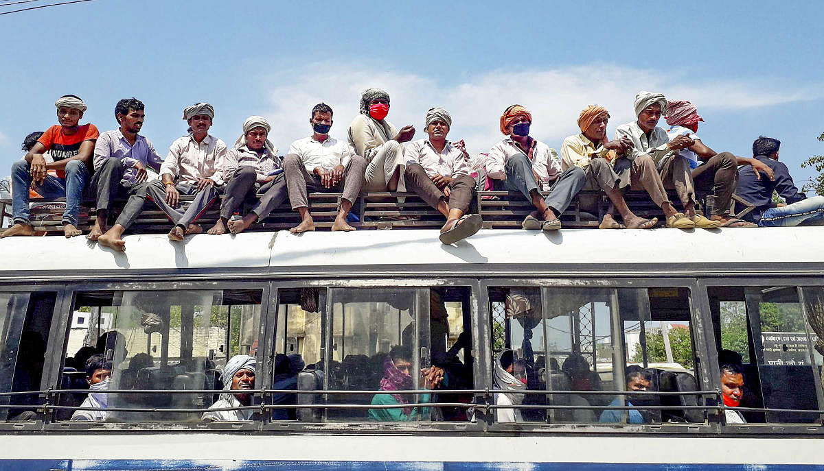 Migrants travelling in a crowded bus during the Covid-19 lockdown in 2020. PTI PHOTO