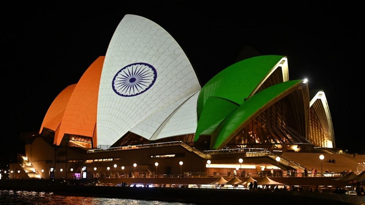 The sails of the Sydney Opera House are lit up to commemorate the 75th anniversary of India's Independence Day. Credit: IANS Photo