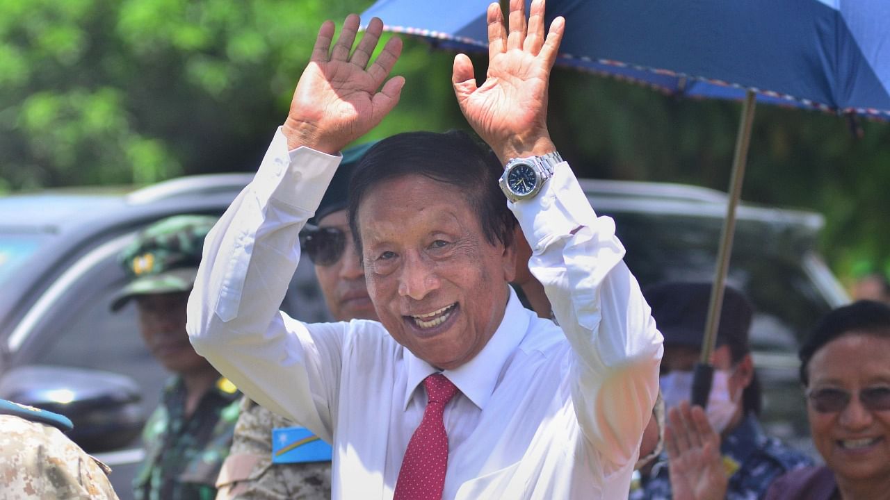 General Secretary of NSCN-IM TH Muivah waves as he leaves after attending the 76th Naga Independence Day celebrations at Hebron. Credit: PTI Photo