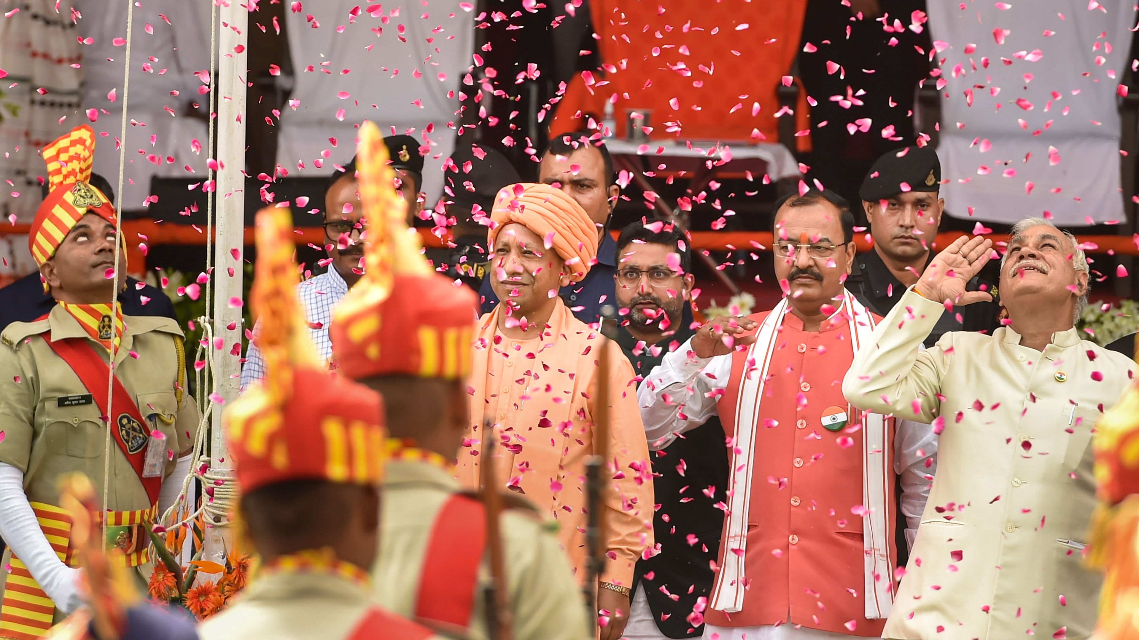 In the backdrop of the national anthem and the showering of flower petals, Adityanath paid tributes to Mahatma Gandhi, the freedom fighters, the unsung heroes of the freedom struggle and the soldiers who sacrificed their lives to defend the integrity of the country. Credit: PTI Photo