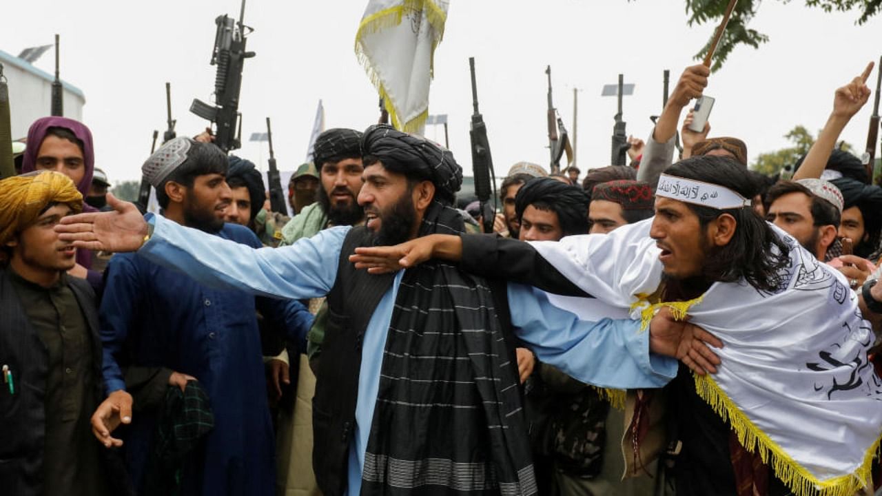 Taliban fighters celebrate the first anniversary of the fall of Kabul. Credit: Reuters Photo