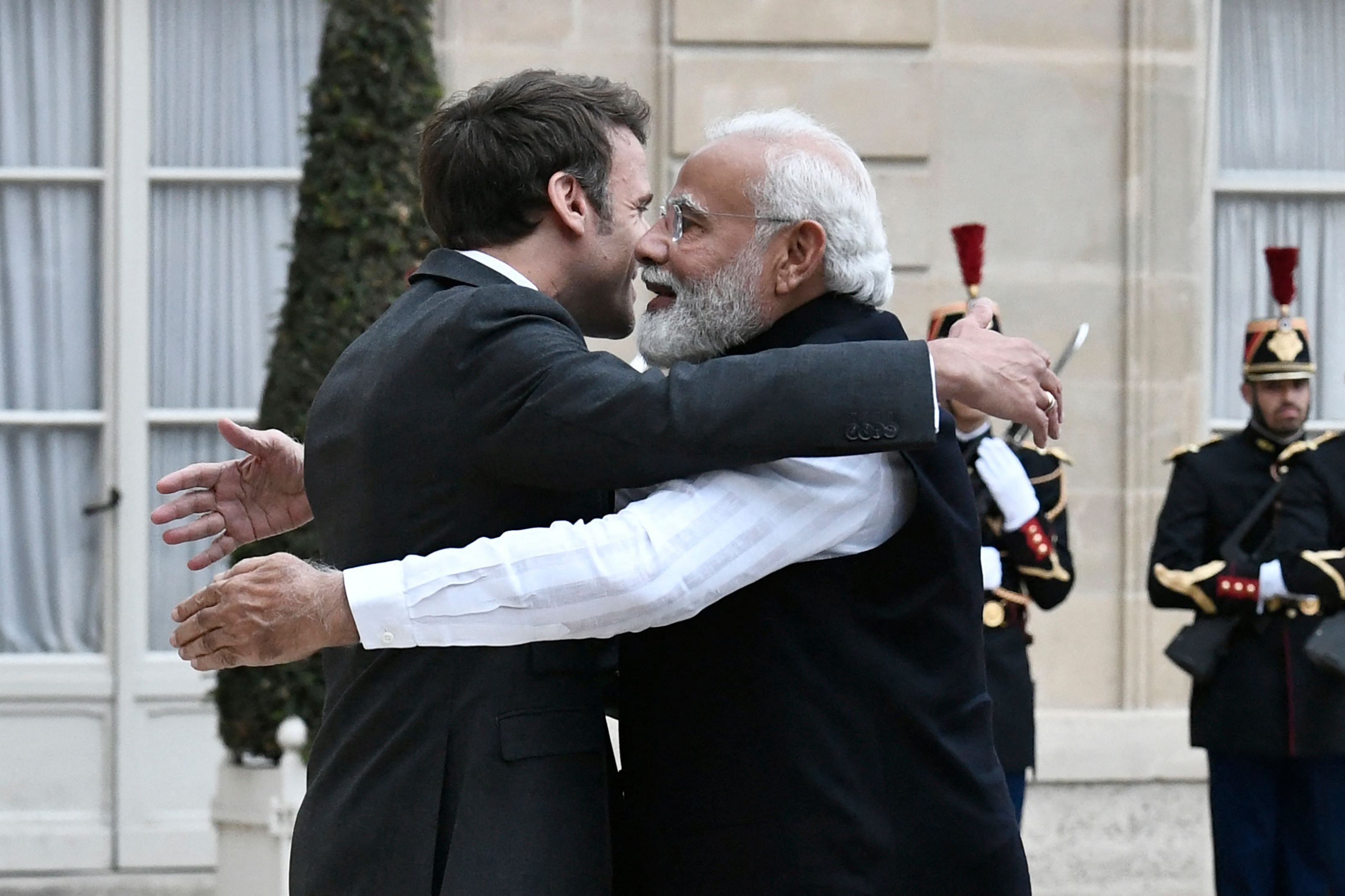 France's President Emmanuel Macron (L) welcomes India's Prime Minister Narendra Modi (R) for a meeting at the Elysee Palace in Paris. Credit: AFP Photo