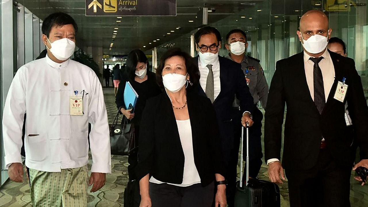 United Nations Special Envoy on Myanmar Noeleen Heyzer (C) walks with high-level officials following her arrival at the airport in Yangon. Credit: AFP Photo/Myanmar's Military Information Team
