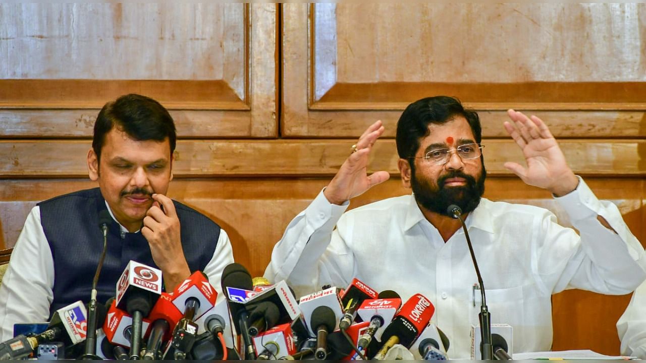 Maharashtra Chief Minister Eknath Shinde with Deputy Chief Minister Devendra Fadnavis addresses a press conference after the customary 'tea party, a day before the commencement of the Monsoon Session of the State Assembly. Credit: PTI Photo