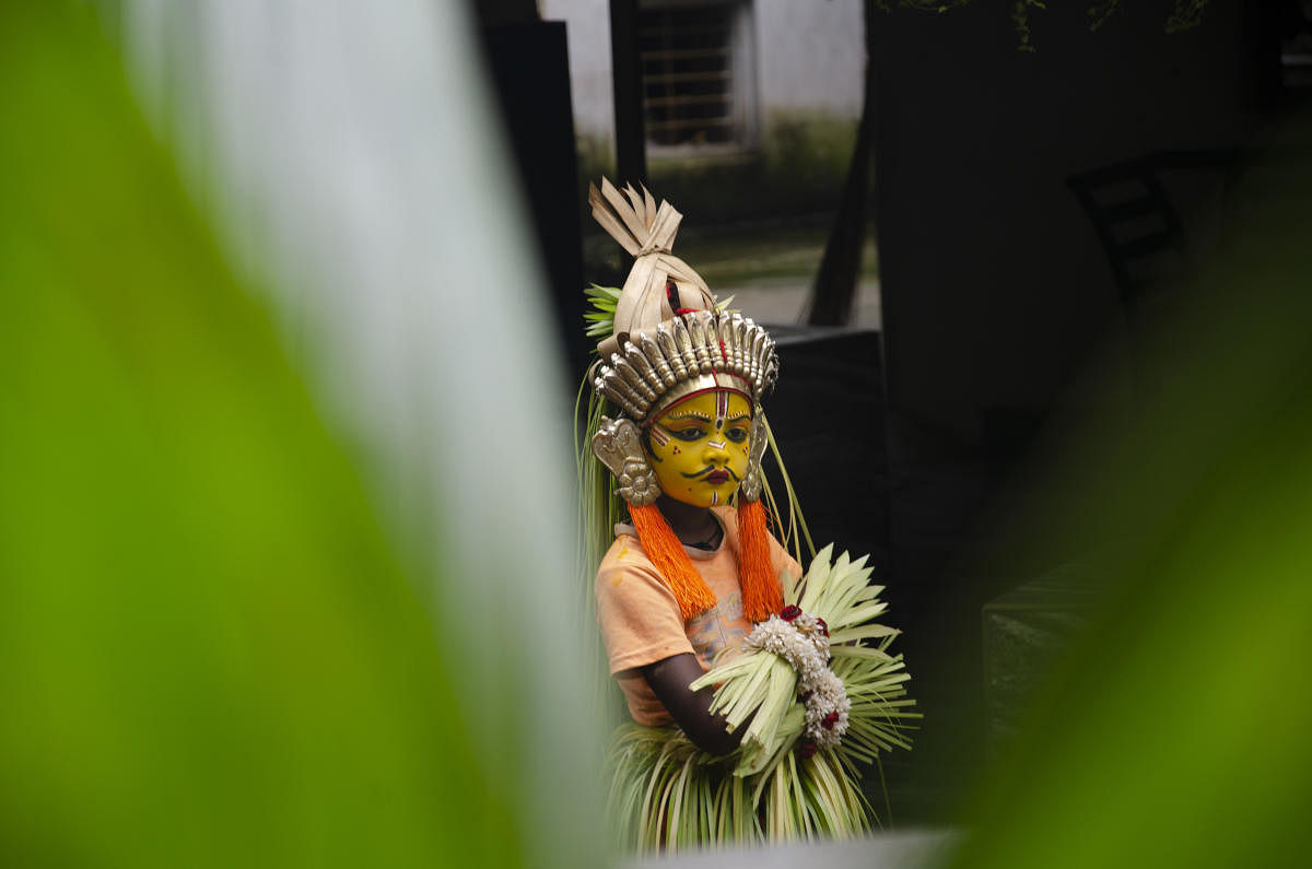 A young boy dons traditional attire of the Aati Kalenja, a folk ritual, and visits homes in a village in Tulunadu.Photos by Shashikanth Shetty