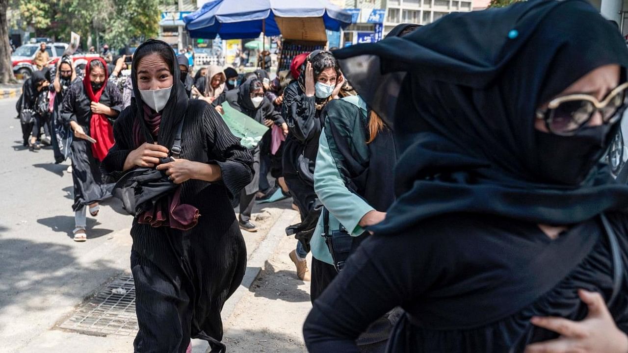 Taliban fighters fire in air to disperse Afghan women protesters in Kabul. Credit: AFP File Photo
