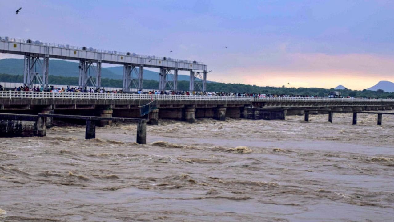 Mahanadi river flows above the danger mark at Naraj barrage following heavy monsoon rainfall, in Cuttack. Credit: PTI Photo