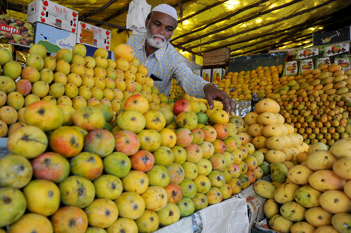 In April, Hindutva groups in Karnataka called for a boycott of Muslim sellers, claiming they were monopolising the mango trade. In pic, a mango seller in Bengaluru. Credit: DH Photo/ Pushkar V